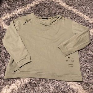 Distressed light green sweater
